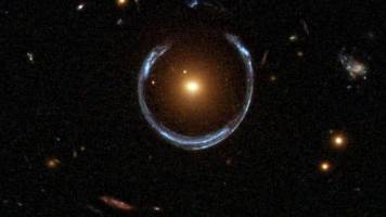 Cosmic magnifying glasses show faster expanding universe