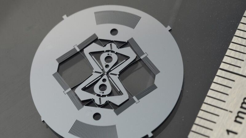 Monolithic flexure-based purely circular pivot with stiffness compensation. Desi